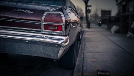 Vintage Chevy Chevelle in Urban Setting wallpaper