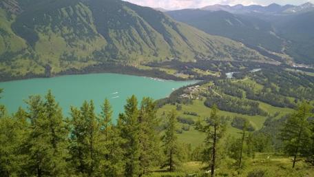 Breathtaking Lake View Surrounded by Mountains and Forests wallpaper