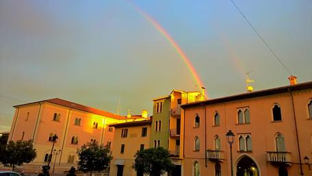 Vibrant Cityscape Under a Colorful Rainbow wallpaper