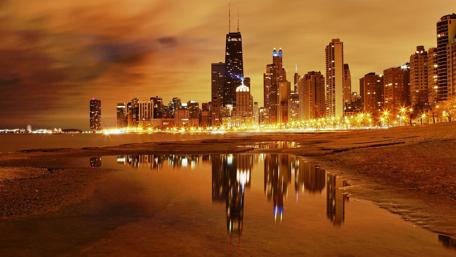 Stunning Reflection of City Lights at Night wallpaper