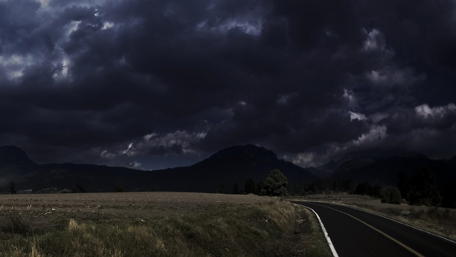 Dark Clouds Over Quiet Landscape wallpaper