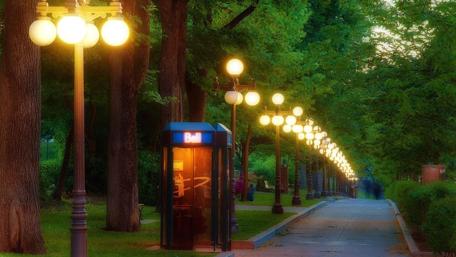 Serene City Street at Dusk with Glowing Lights wallpaper