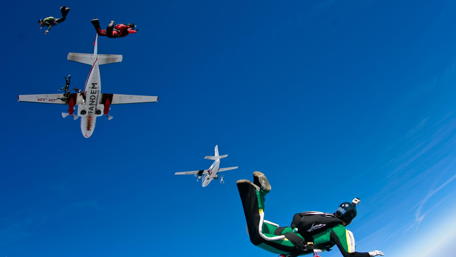 Skydivers in Action Against a Brilliant Blue Sky wallpaper