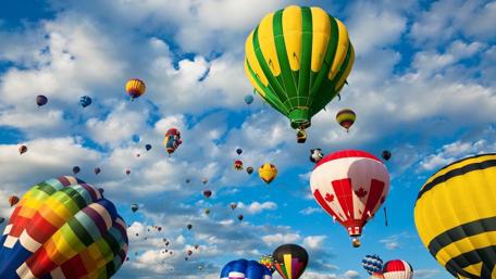 Soaring Dreams in a Balloon-Filled Sky wallpaper