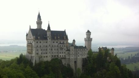Majestic Fantasy Castle Above the Misty Valleys wallpaper