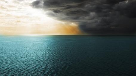 Sunrays Breaking Through Storm Clouds wallpaper