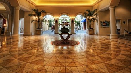 Elegant Lobby with Graceful Palm Trees and Intricate Flooring Design wallpaper