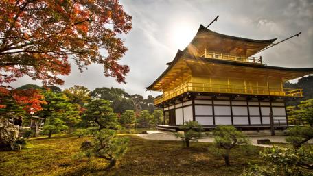 Serene Autumn Scene of a Traditional Japanese Temple wallpaper