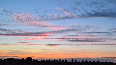 Tranquil Sunset Over Rolling Hills wallpaper