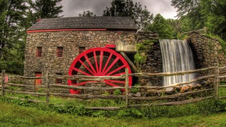 Historic Mill with Vibrant Paddlewheel wallpaper