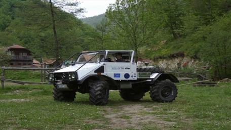 Ultimate Adventure Vehicle in Nature's Embrace wallpaper