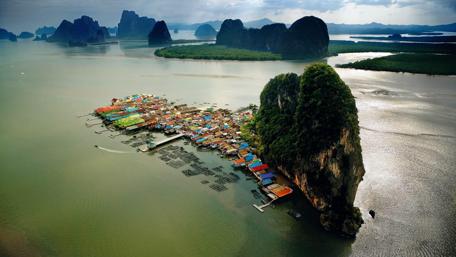 Serenity Over the Floating Village in Nature's Embrace wallpaper