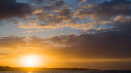 Serene Sunset Over Tranquil Waters wallpaper