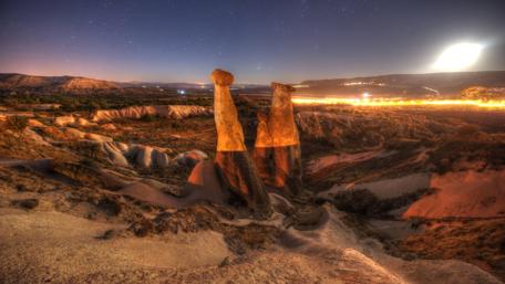 Majestic Rock Formations Under Night Sky wallpaper