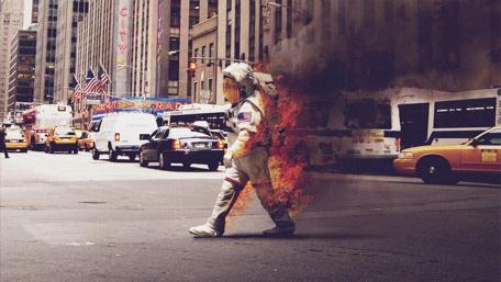 Astronaut Walking Through a Vintage City Scene wallpaper