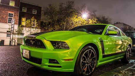 Vibrant Green Dream Car Under Night Lights wallpaper
