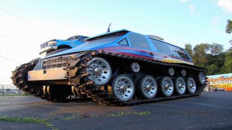 Futuristic Heavy-Duty All-Terrain Vehicle Displayed Outdoors wallpaper