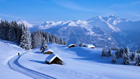 Winter Serenity in a Snowy Mountain Village wallpaper