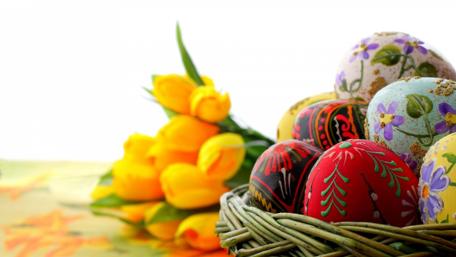 Colorful Easter Eggs in a Basket Decorated with Tulips wallpaper