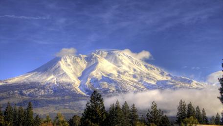Majestic Mountain Under a Clear Blue Sky wallpaper