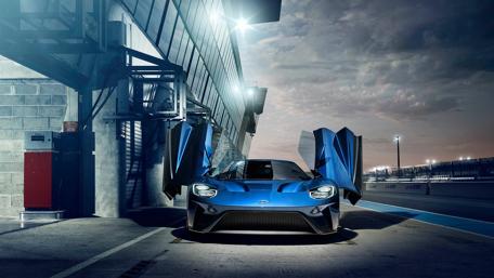 Sleek Blue Dream Car in a Modern Setting wallpaper