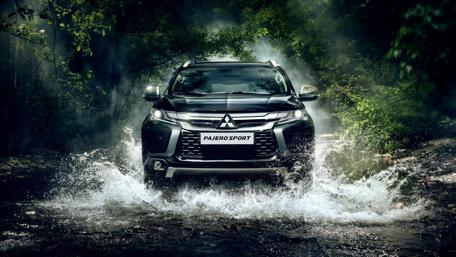 Powerful SUV in Nature's Embrace wallpaper