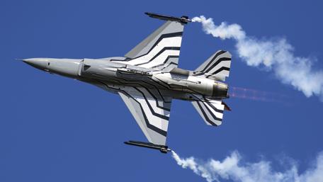 Fighter Jet in Action High Above the Sky wallpaper
