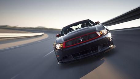 Dynamic Black Sports Car on the Move wallpaper