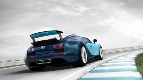 Elegant Blue Sports Car in Motion wallpaper