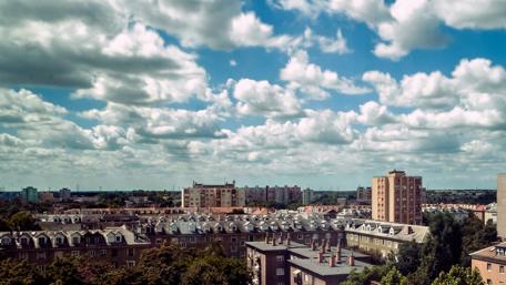 Urban Skyline Under Cloudy Skies wallpaper