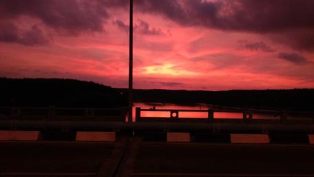 Vibrant Sunset Over Tranquil River Scene wallpaper