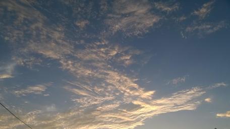 Serene Sky with Whimsical Clouds wallpaper