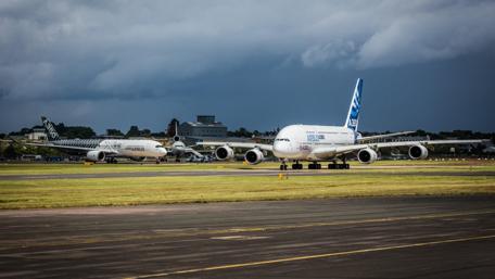 Airplanes in Action at the Airport Ground Scene wallpaper