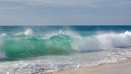 Ocean Waves Embracing the Shore wallpaper