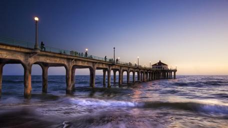 Serene Sunset at the Pier Overlooking the Ocean wallpaper