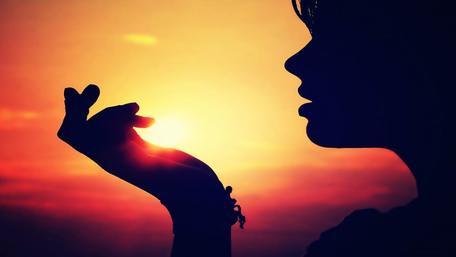 Embracing the Sun's Warmth in Silhouette wallpaper