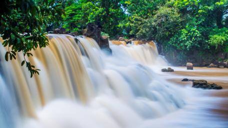 Majestic Waterfall in Tranquil Nature Scene wallpaper