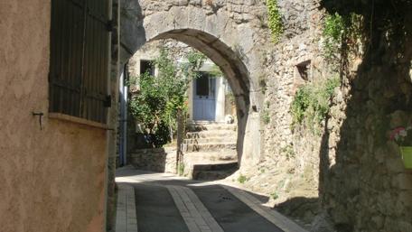 Charming Pathway Through a Historic Village wallpaper