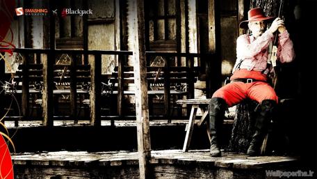 Vintage Cowboy in Rustic Setting Wallpaper wallpaper