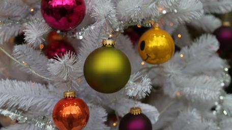 Vibrant Ornaments on a White Christmas Tree wallpaper