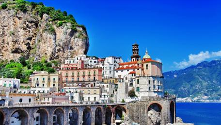 Charming Coastal Village Under Blue Skies wallpaper