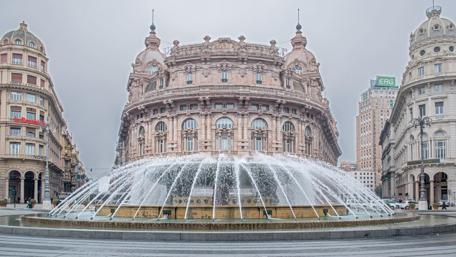 Majestic Fountain in a City Square wallpaper