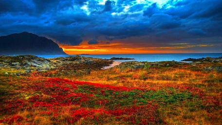 Vibrant Sunset Over Serene Coastal Landscape wallpaper