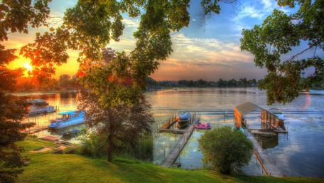 Sunset Serenity Over a Tranquil Lake wallpaper
