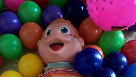 Cheerful Chaos in a Colorful Ball Pit wallpaper