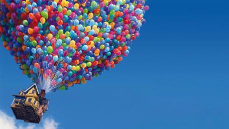 Soaring Dreams in a Balloon-Lifted House wallpaper