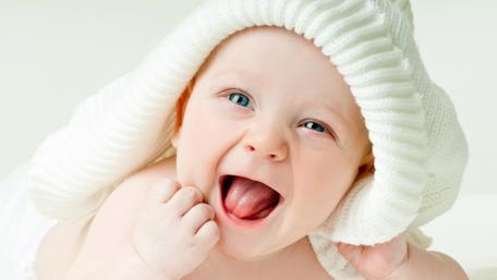 Joyful Baby's First Smile in 4K Wallpaper wallpaper