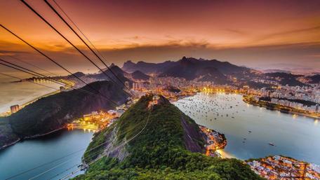 Golden Sunset Over Coastal City wallpaper