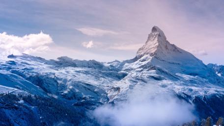 Snow-Covered Mountain Peak in 4K wallpaper