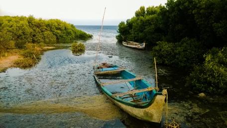 Lonely Boat in Serene Waters wallpaper